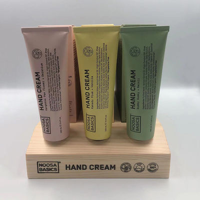 Banco di mostra cosmetico della crema per le mani del supporto dell'esposizione di legno del deposito